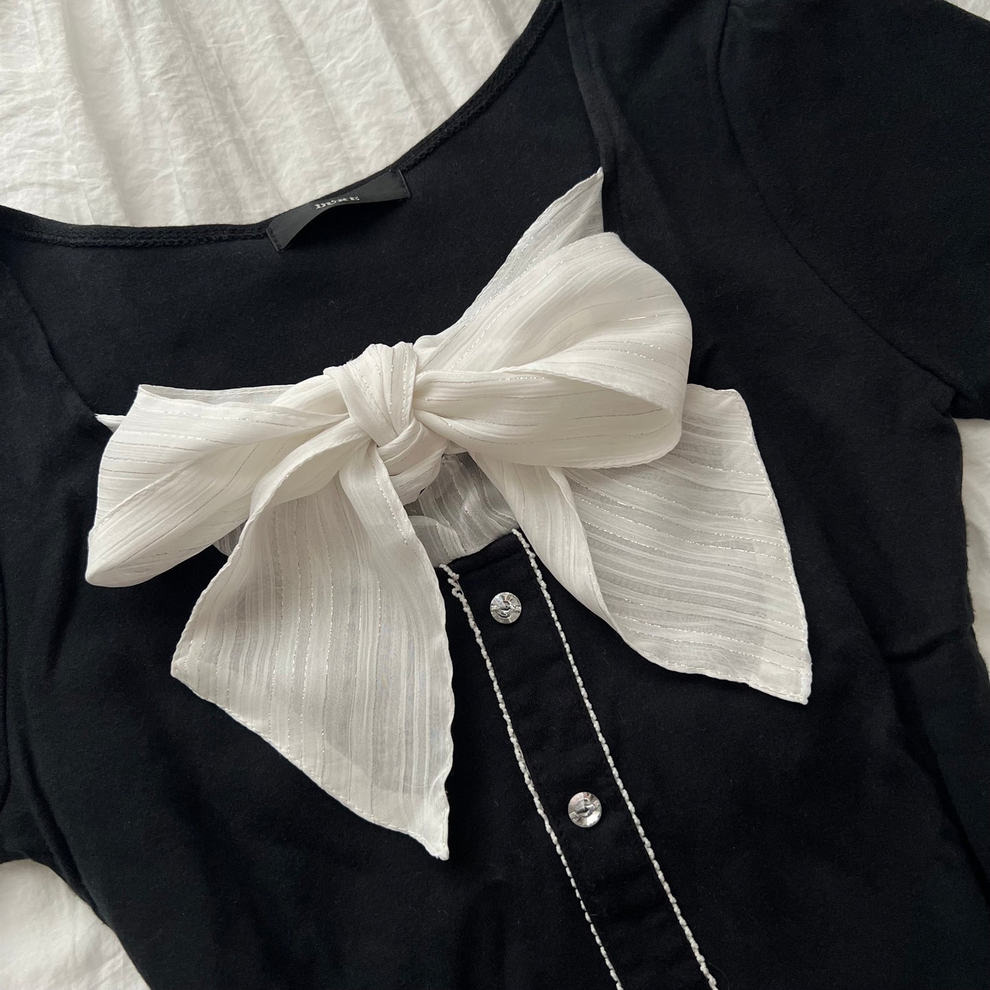 Black front ribbon top