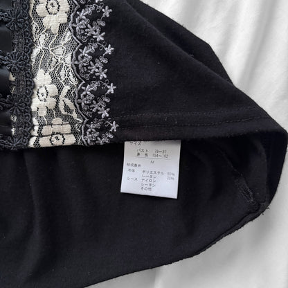 ‘Axes Femme’ Black Top with White Lace Details