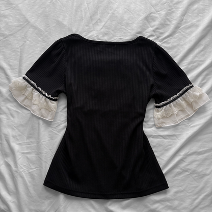 ‘Axes Femme’ Black Top with White Lace