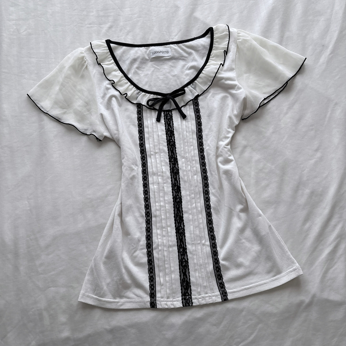 Ivory top with frilly sleeves & neckline