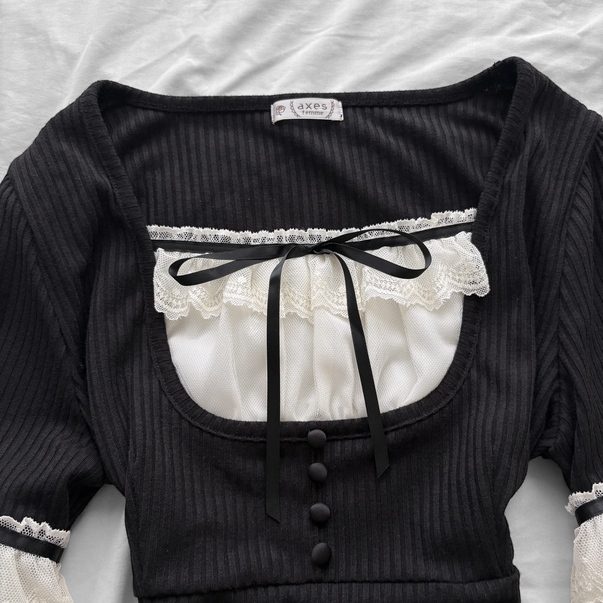 ‘Axes Femme’ Black Top with White Lace