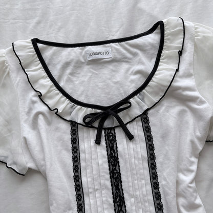 Ivory top with frilly sleeves & neckline