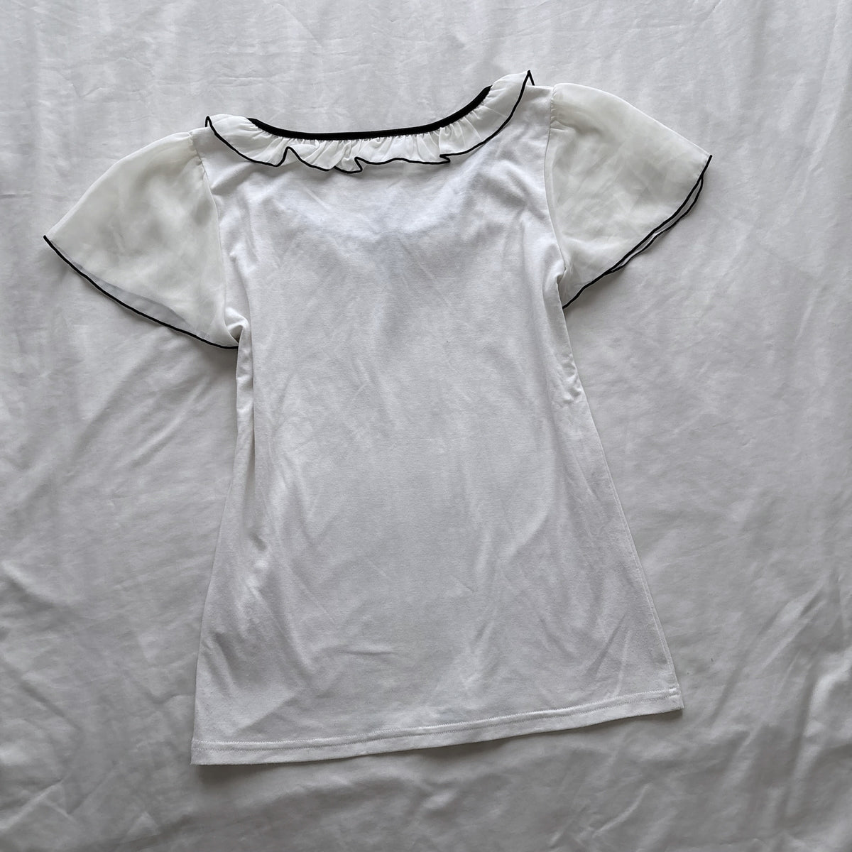 Ivory top with frilly sleeves & neckline