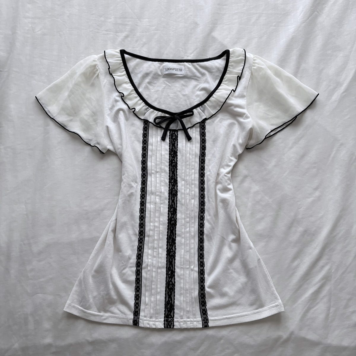 Ivory top with frilly sleeves & neckline