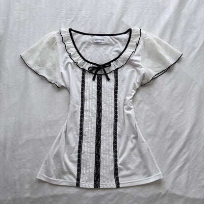 Ivory top with frilly sleeves & neckline