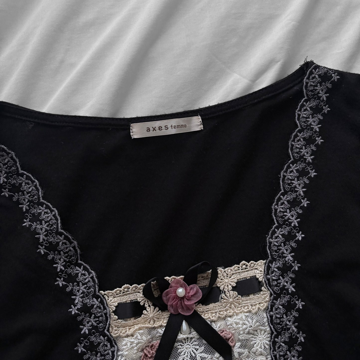‘Axes Femme’ Black Top with White Lace Details