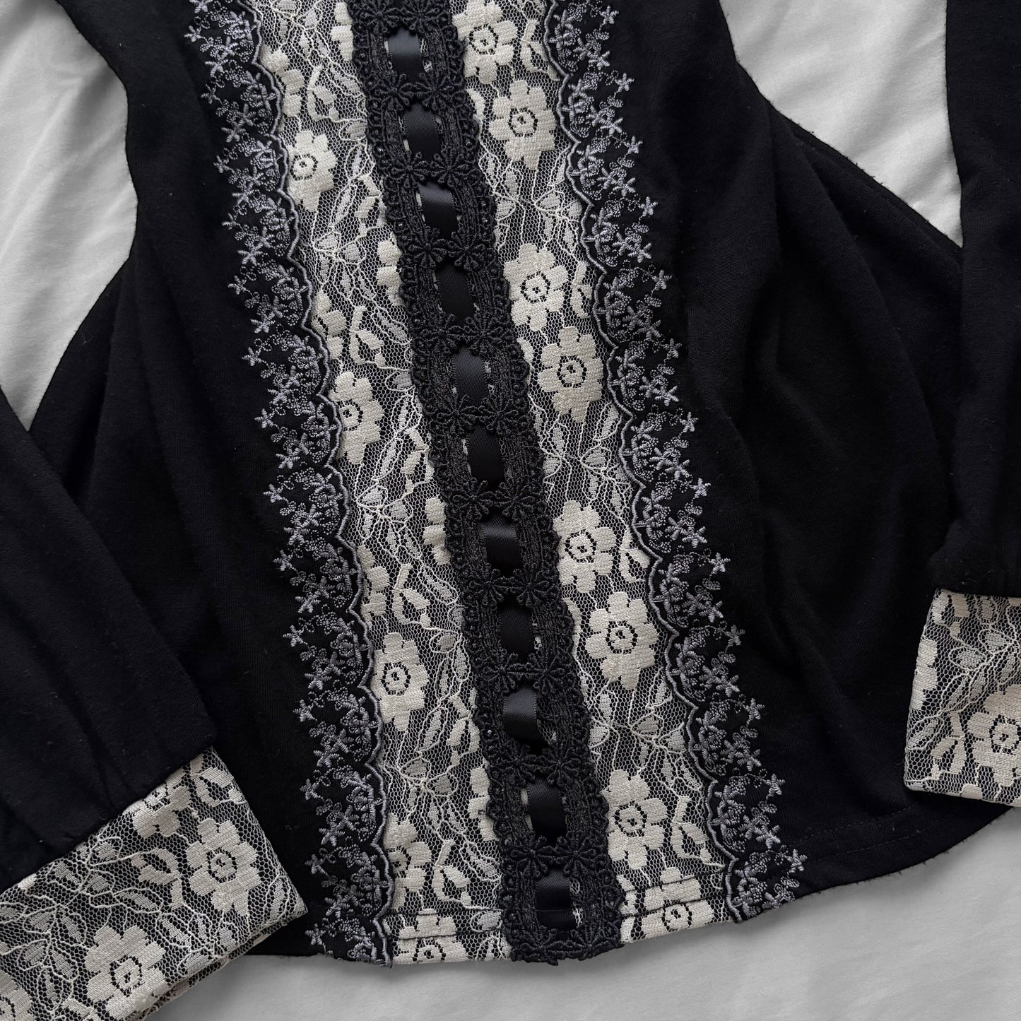 ‘Axes Femme’ Black Top with White Lace Details