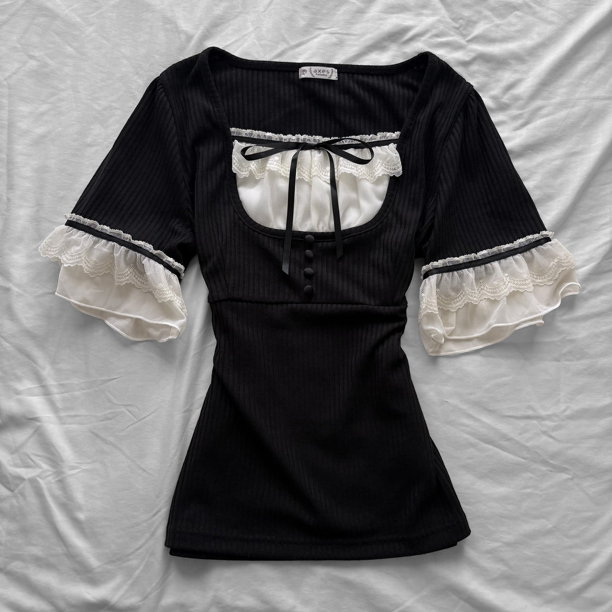 ‘Axes Femme’ Black Top with White Lace