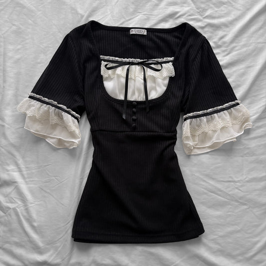 ‘Axes Femme’ Black Top with White Lace