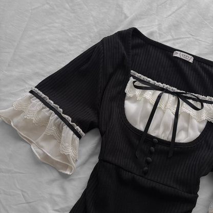 ‘Axes Femme’ Black Top with White Lace