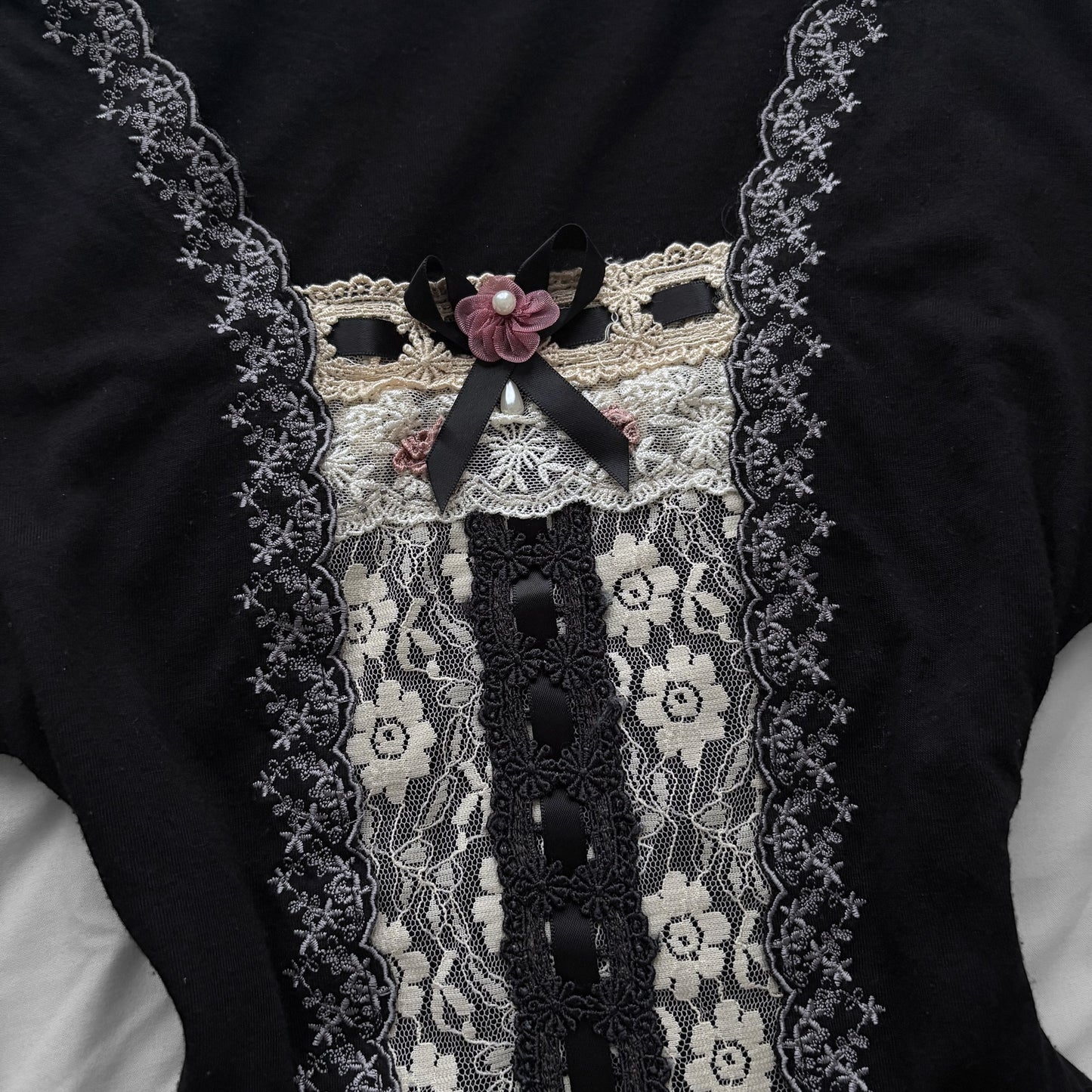 ‘Axes Femme’ Black Top with White Lace Details