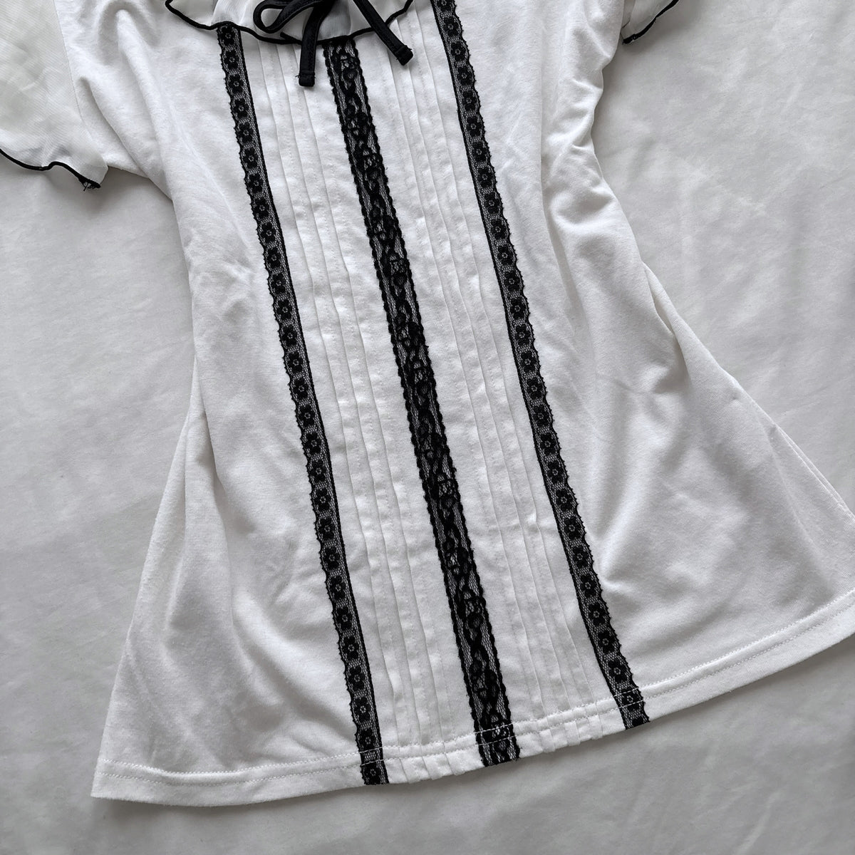 Ivory top with frilly sleeves & neckline