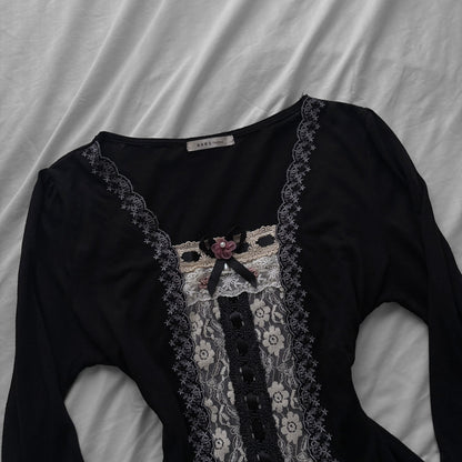 ‘Axes Femme’ Black Top with White Lace Details