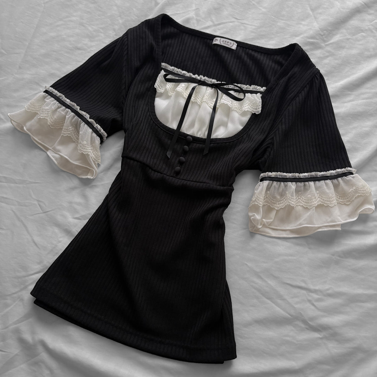 ‘Axes Femme’ Black Top with White Lace