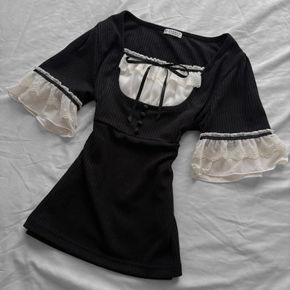 ‘Axes Femme’ Black Top with White Lace