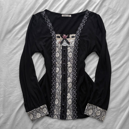 ‘Axes Femme’ Black Top with White Lace Details